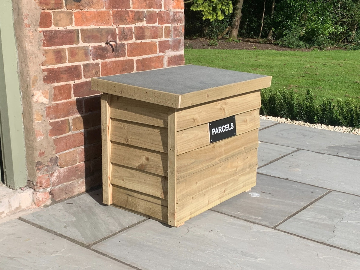 Natural DelSafe wooden parcel delivery box with grey felt roof in a garden setting