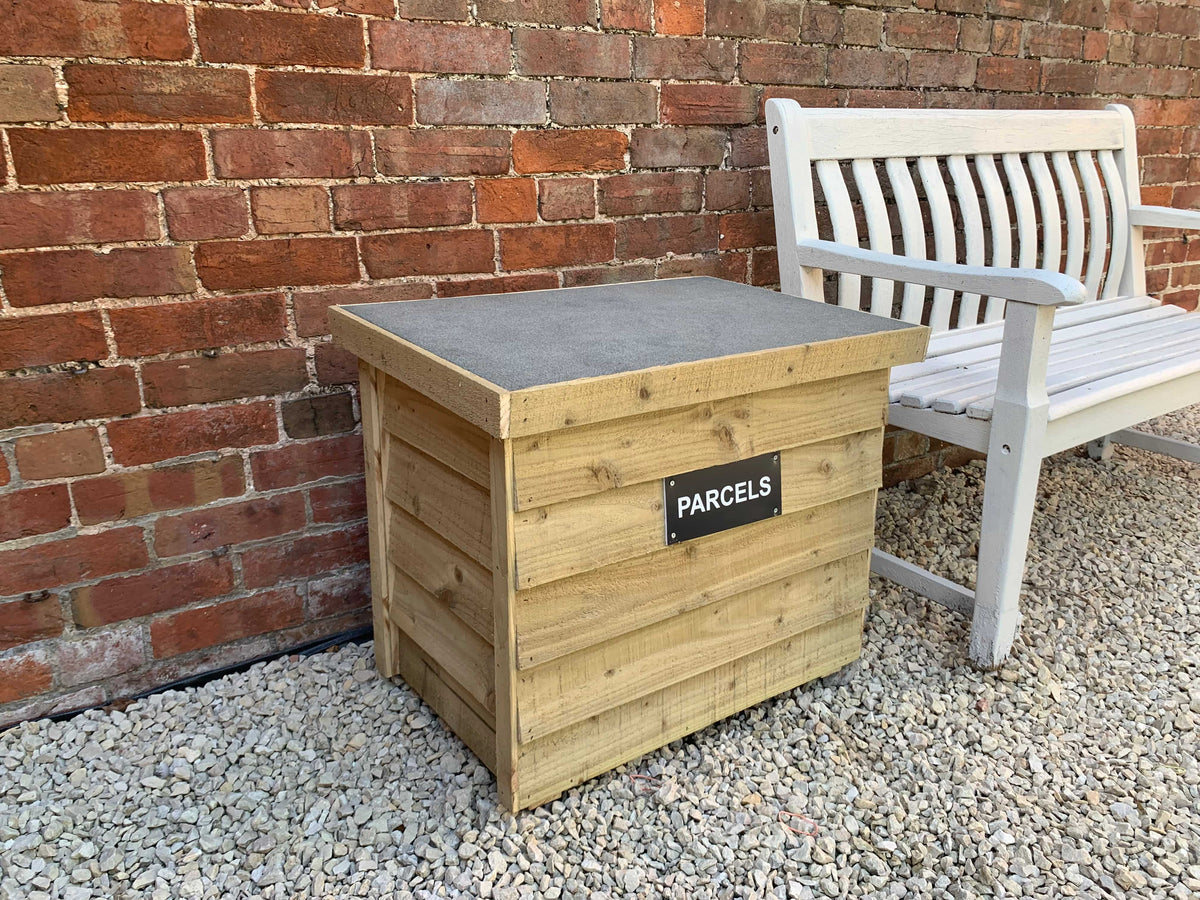 Natural DelSafe wooden parcel delivery box in an outdoor seating area